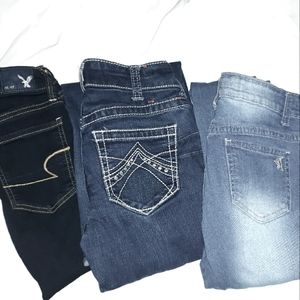 Ariat, American Eagle, and V. I. P. jeans.. selling as a lot
